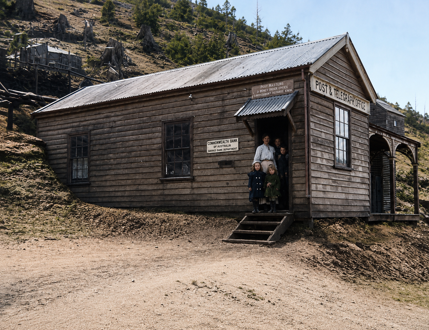 Historic Magnet post and telegraph office with a family at the entrance